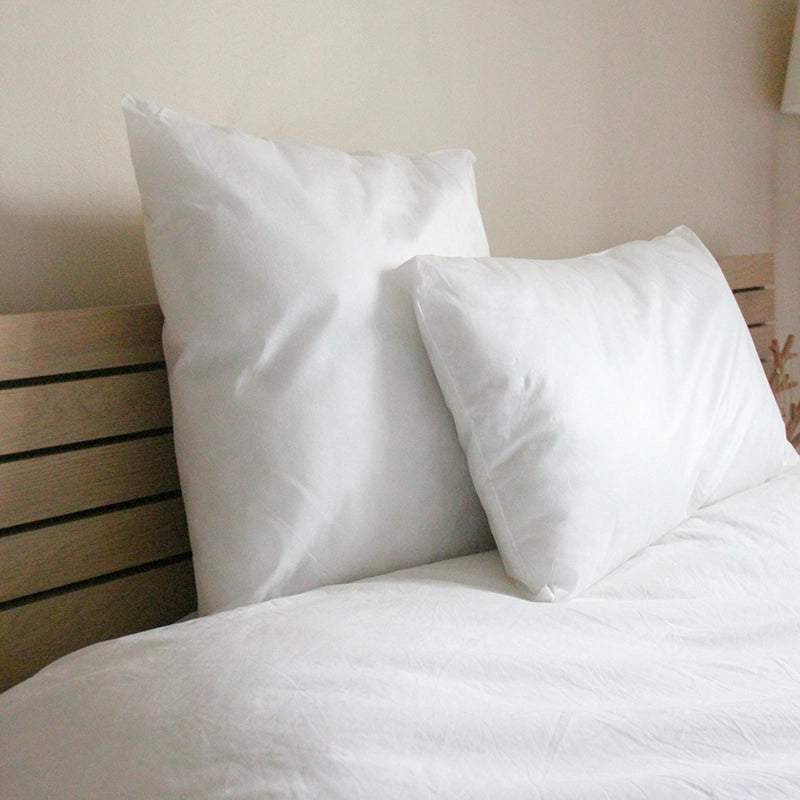 Oreiller Jetable Confort sur un lit