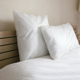 Oreiller Jetable Confort sur un lit