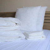 Parure Housse De Couette Biodegradable Prestige sur un lit